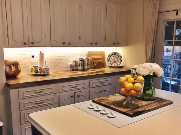reviewer's kitchen cabinets with lighting installed underneath