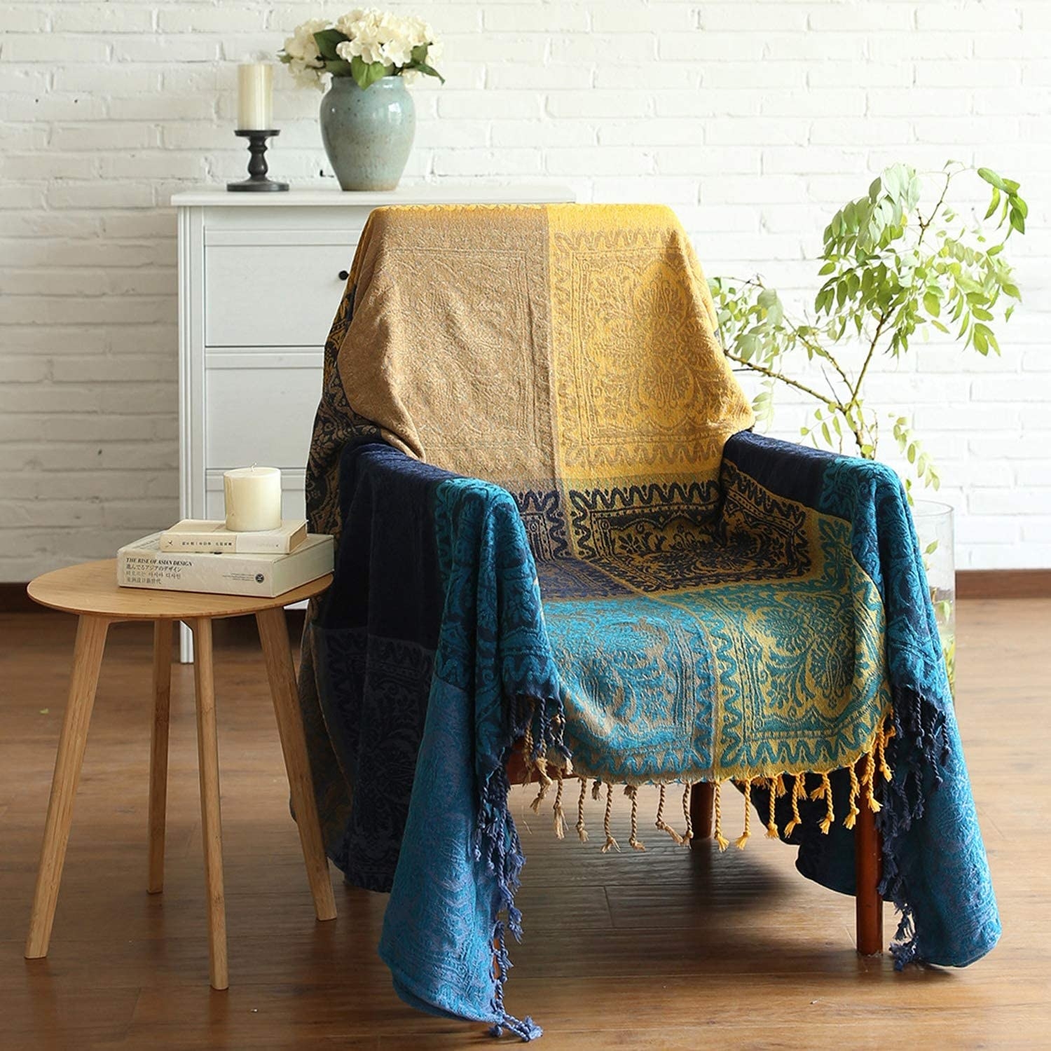 the blue and gold MayNest bohemian blanket on a chair