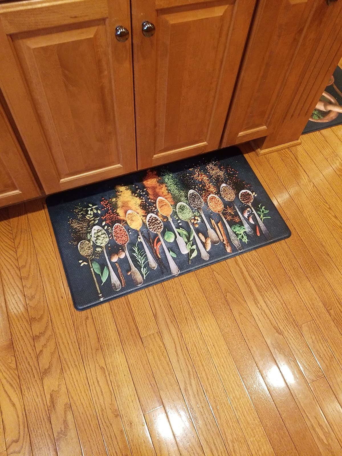 reviewer image of the spicy anti-fatigue mat on a kitchen floor