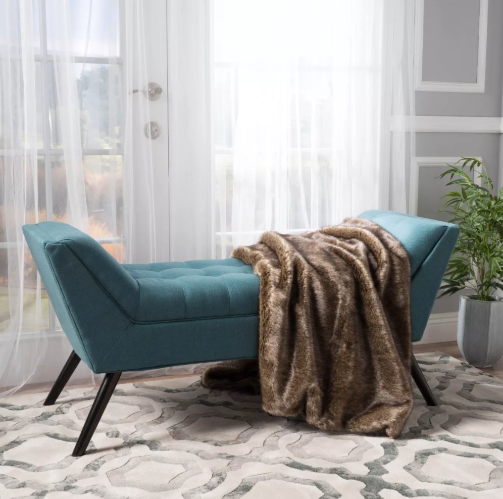 the tufted settee bench in blue