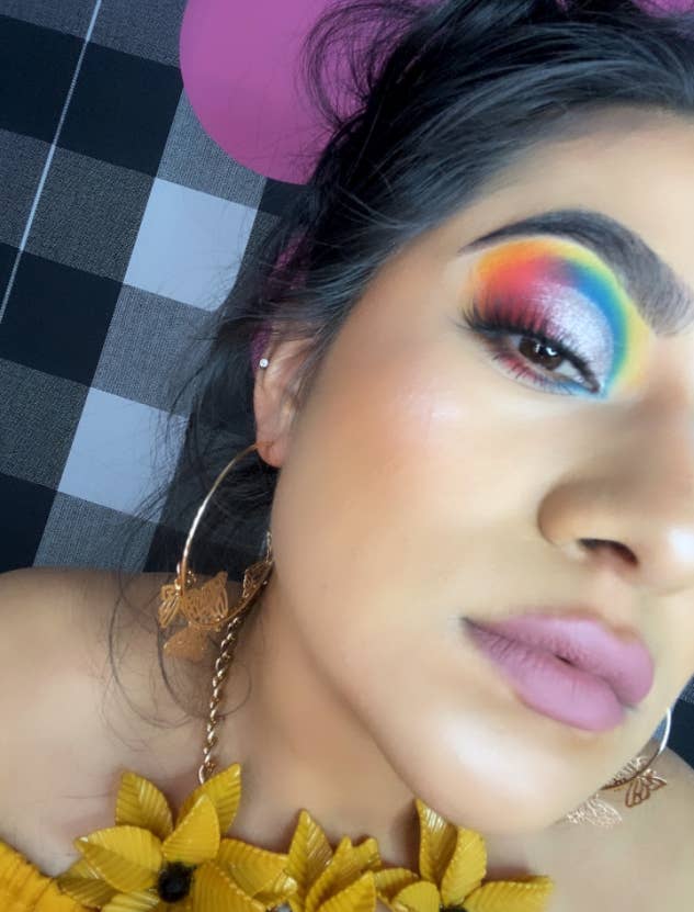 reviewer image wearing a bold eyeshadow look with tons of bright colors