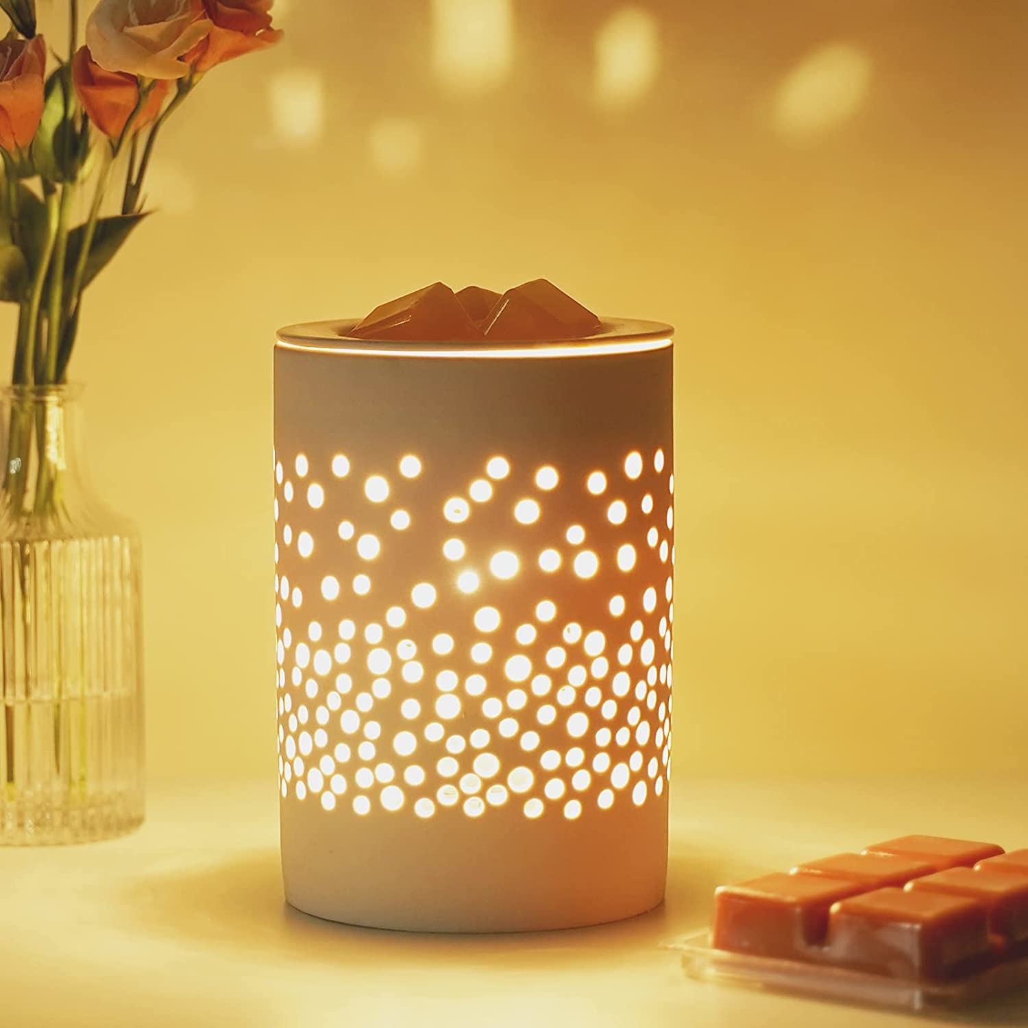 wax melter with holes in the side that let the light shine through