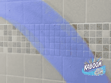a gif of the spray turning from blue to white and a person cleaning the tiled wall