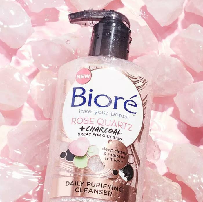 Bottle of Biore rose quartz cleanser surrounded by rose quartz