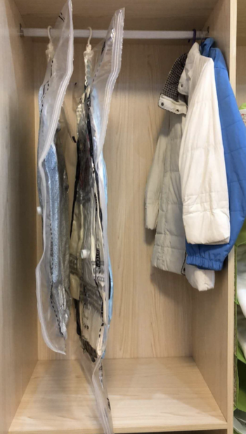 The same clothes with all the air sucked out of the bag taking up a tiny fraction of the space