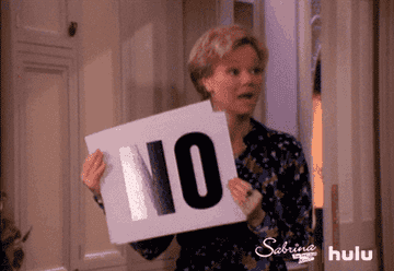 Zelda holding up a sign that says &quot;NO&quot; in Sabrina the Teenage Witch