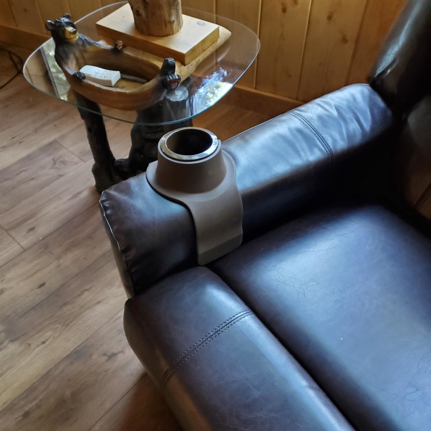 reviewer image of the gray CouchCoaster on an armchair