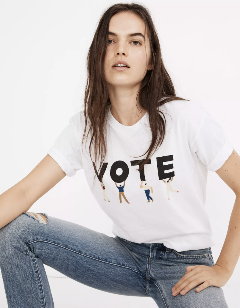 a model wearing a white &quot;vote&quot; t-shirt