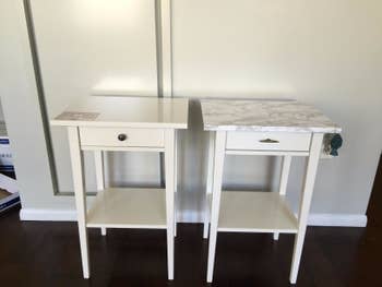 reviewer's identical white side tables, one plain and one with white marble contact paper on the top