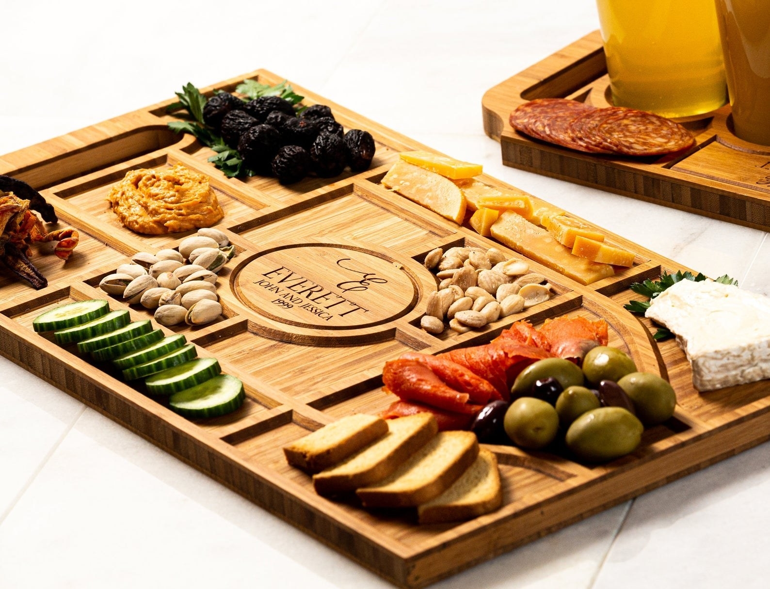 an assortment of nuts and cheese on a personalized charcuterie board