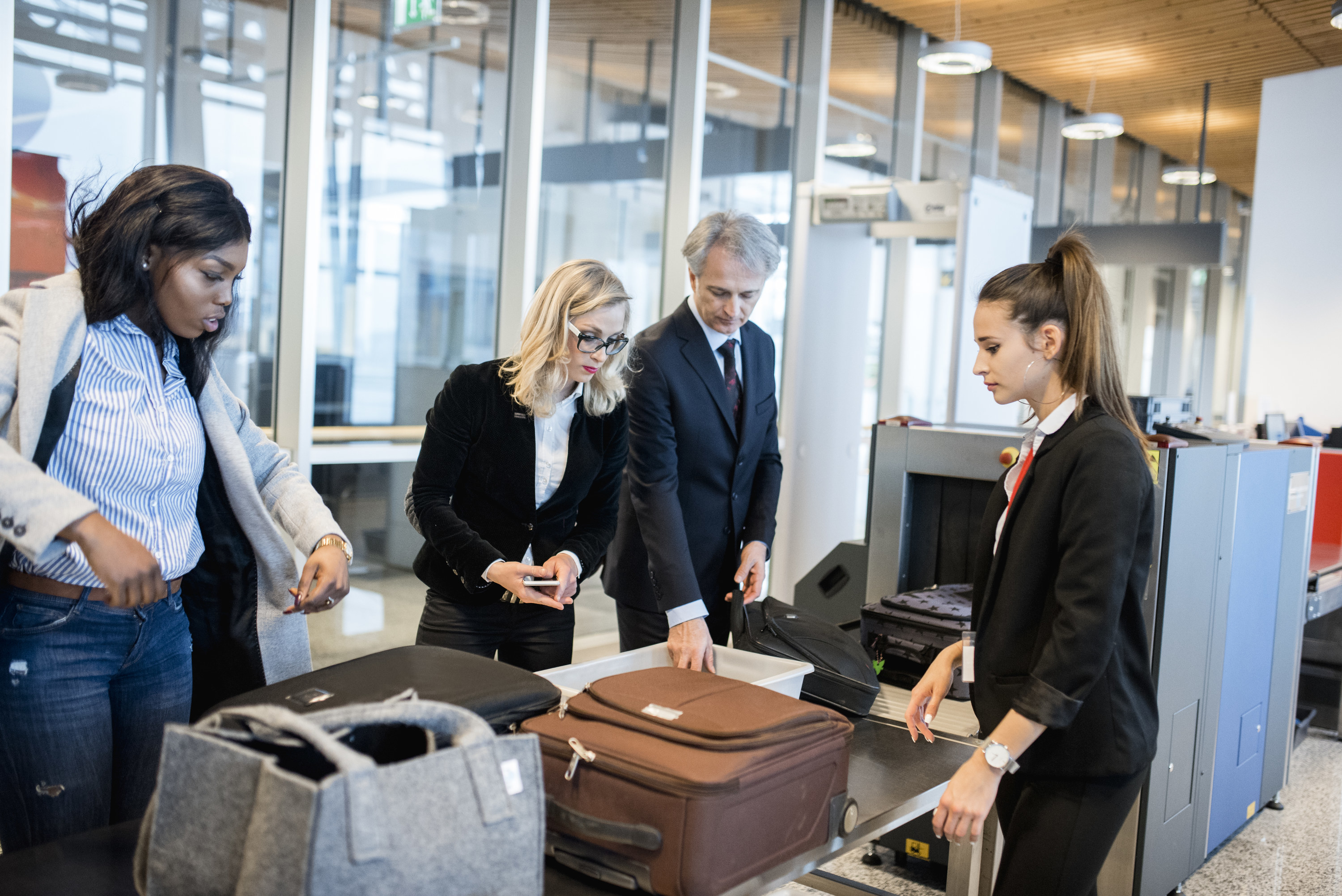 Group of people going through airport security