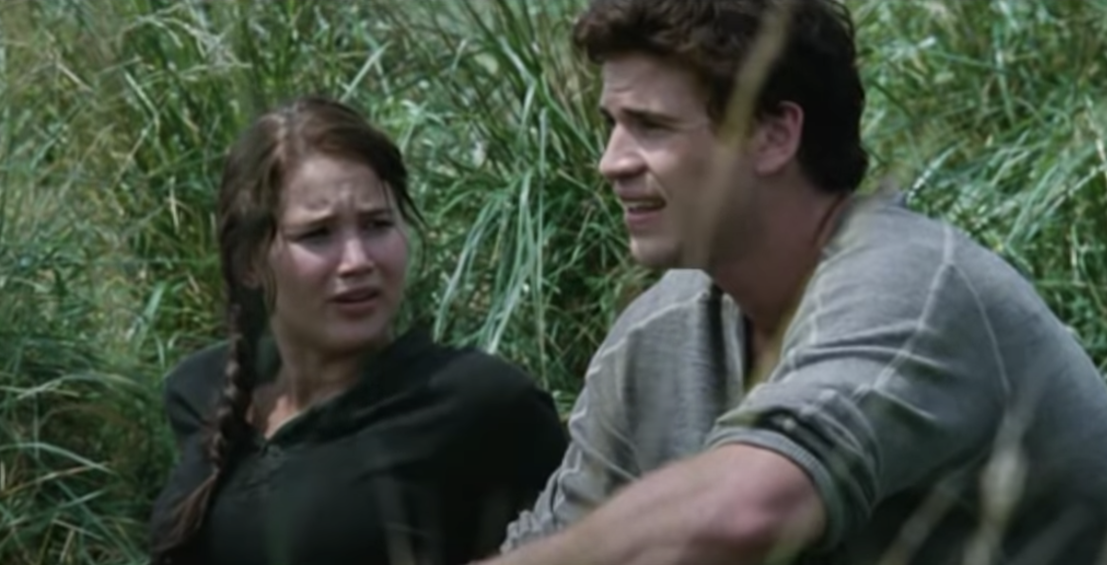 Katniss and Gale sitting in the meadow