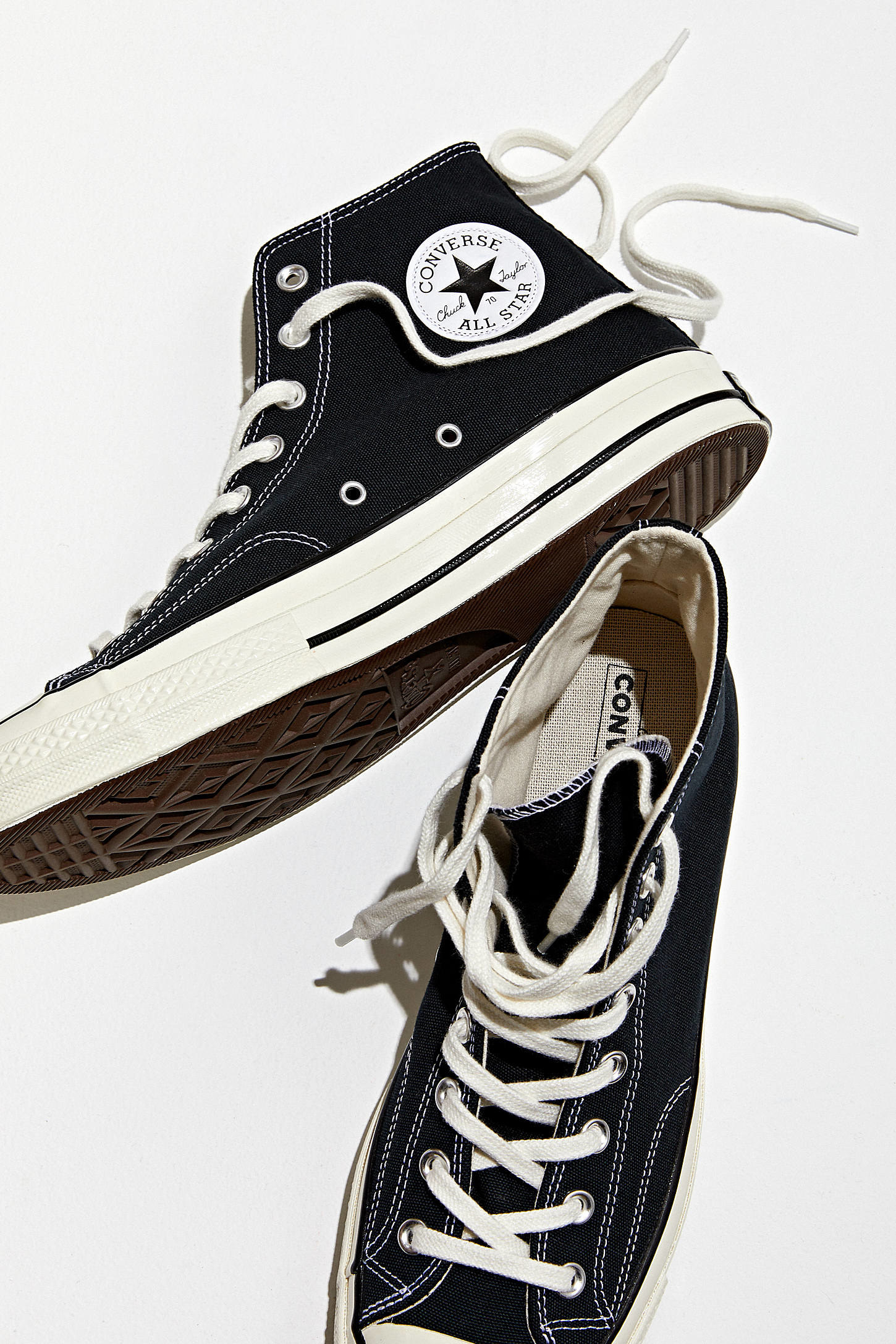 a pair of chuck converse shoes