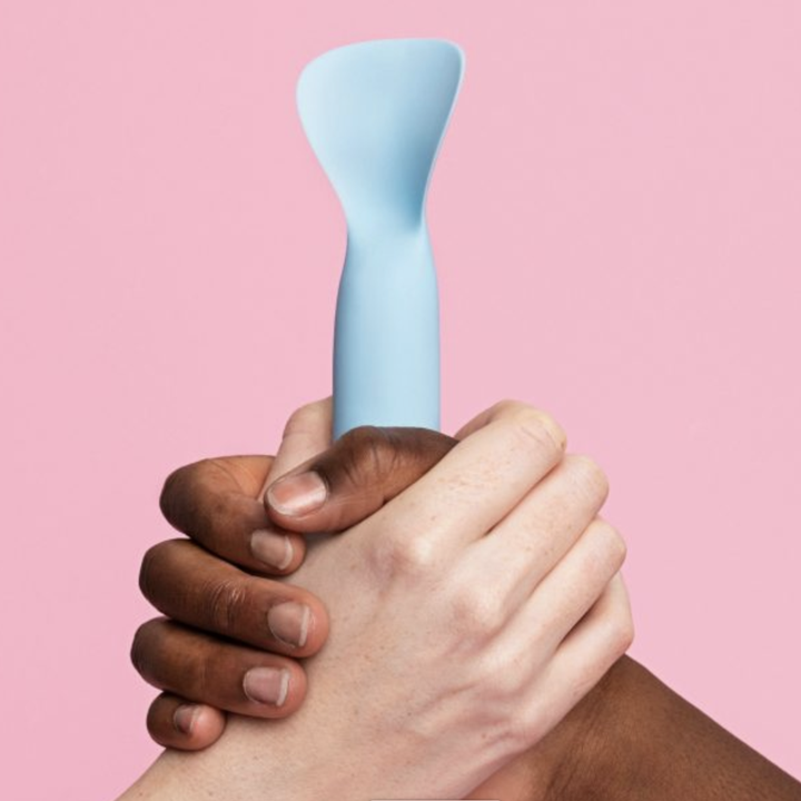 Two models holding light blue vibrator