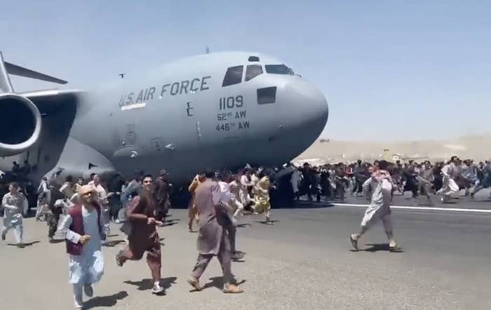 &quot;People run on tarmac of Kabul international airport as a US military aircraft attempts to take off&quot;