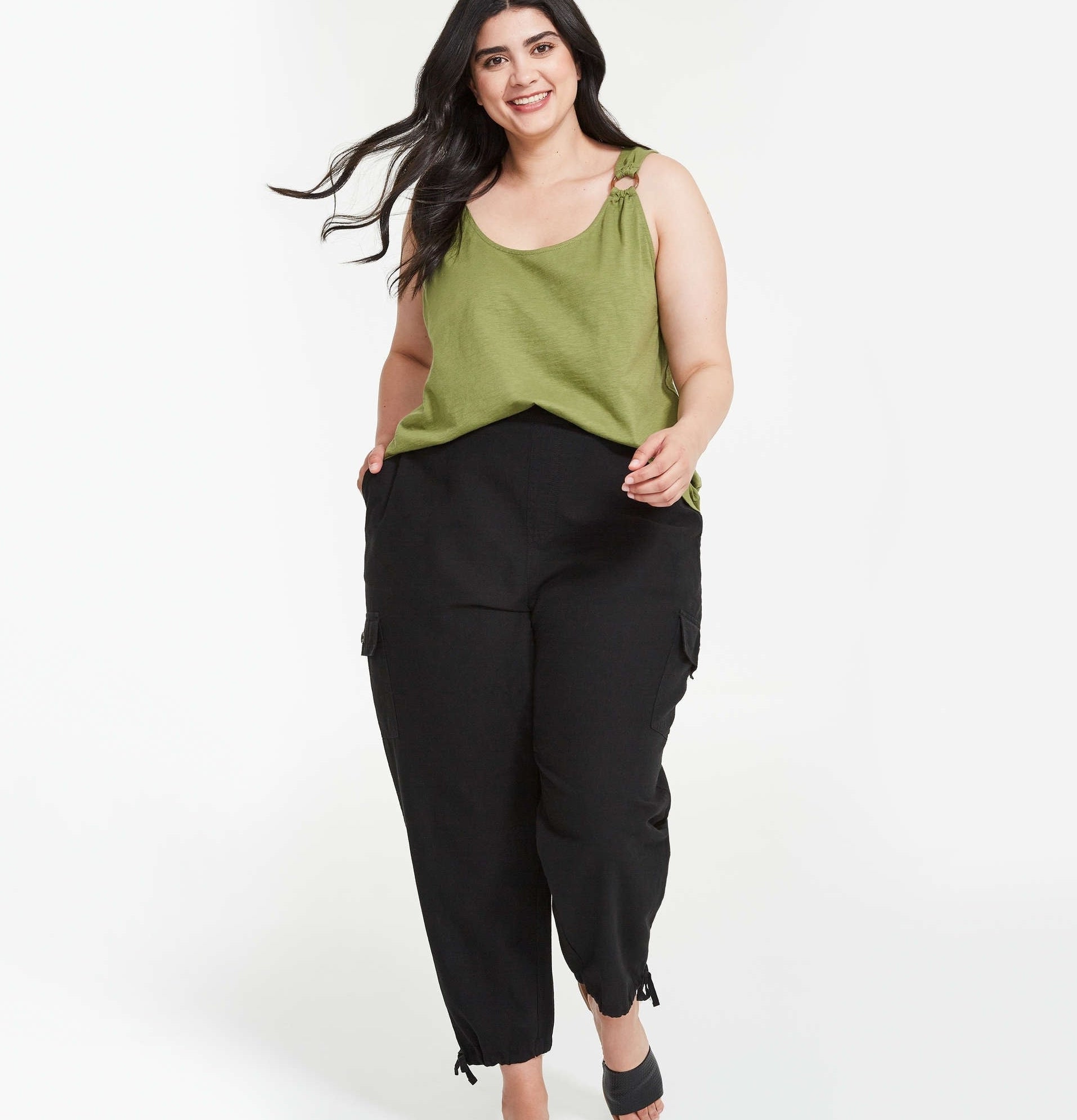 a person wearing the cargo pants with a tank