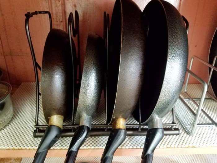 reviewer photo of four pans being stored in the pan rack