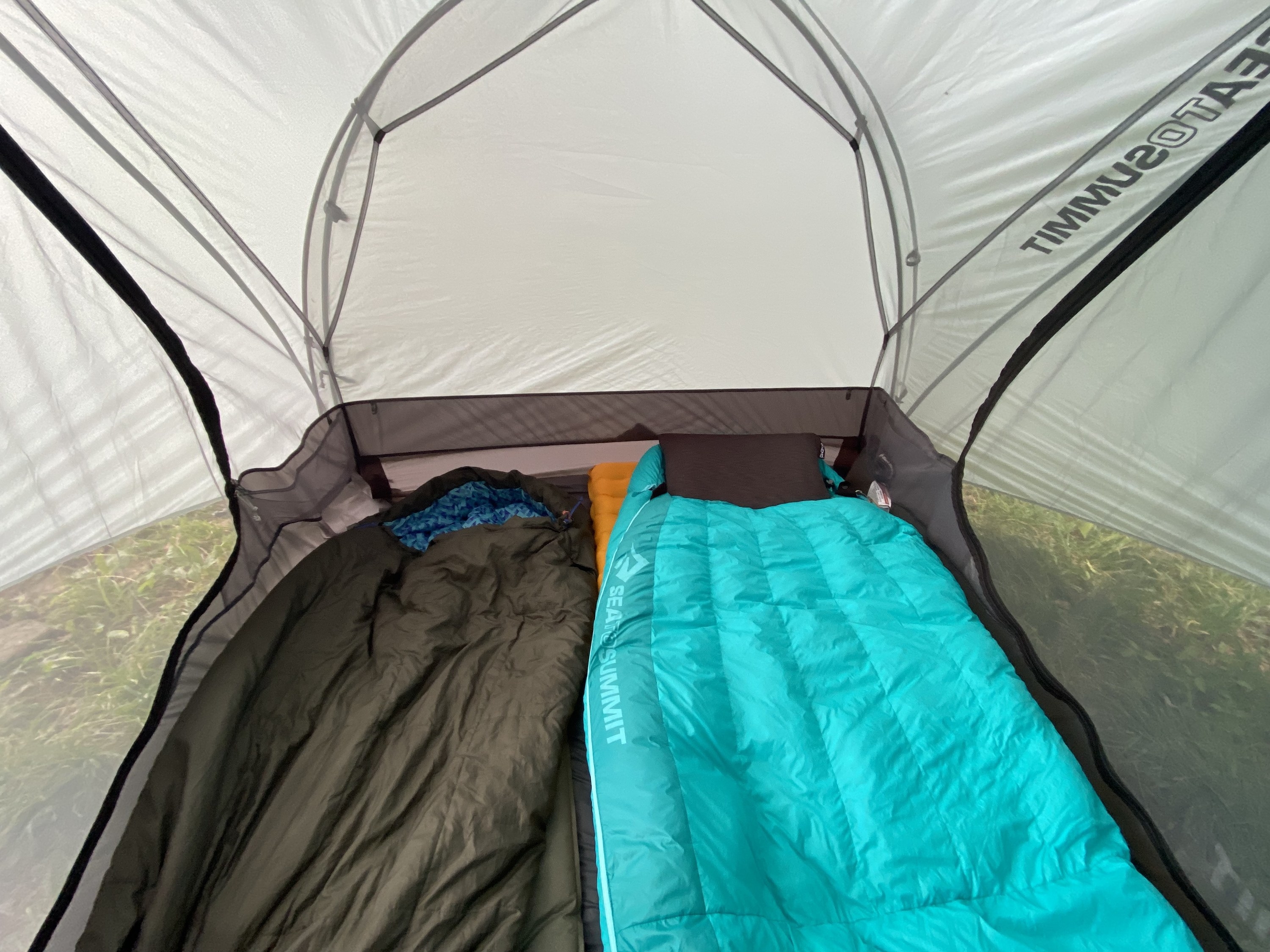 the inside of the tent with two sleeping bags