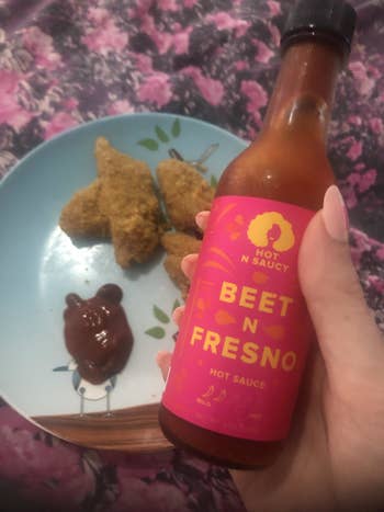 bottle of hot sauce with chicken nuggets
