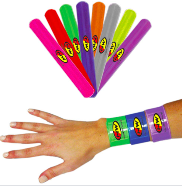 Hand and arm with lots of colorful slap bracelets on them