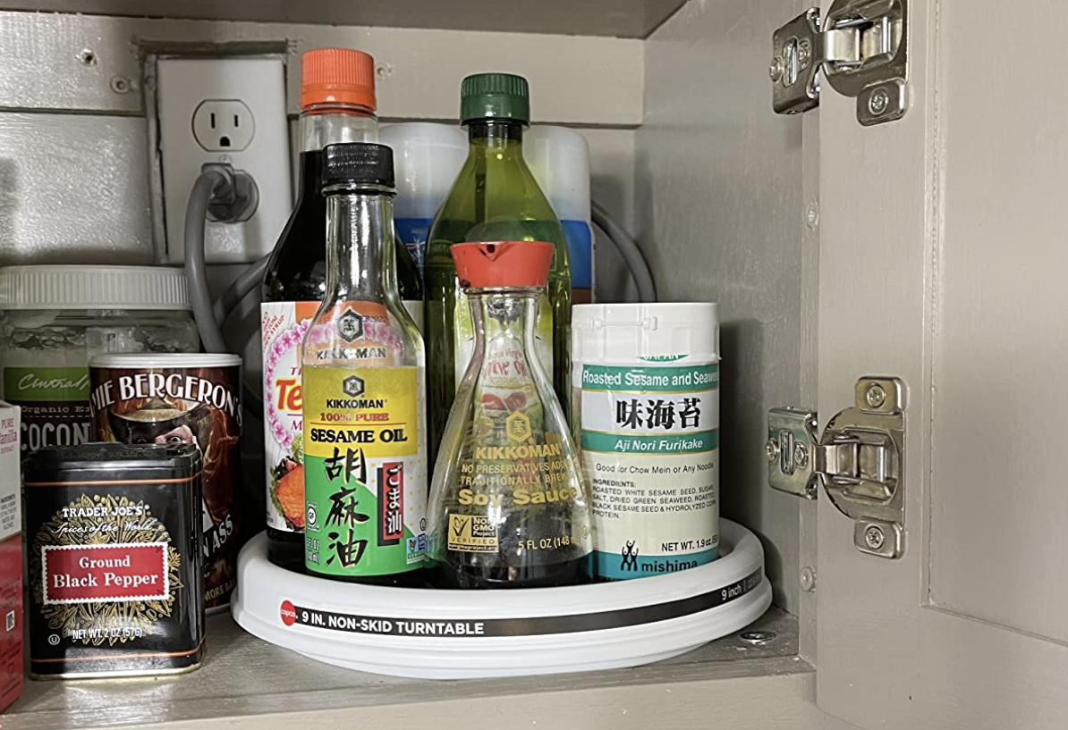 lazy susan in reviewer&#x27;s cabinet holding various condiments