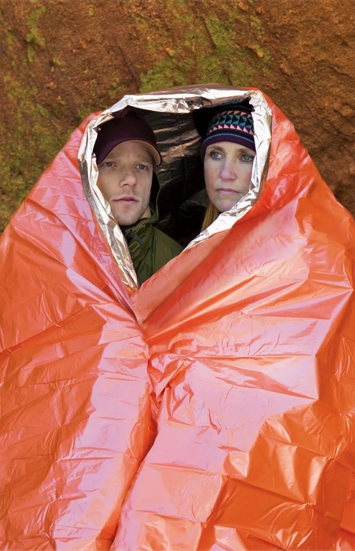 two models in the orange blanket
