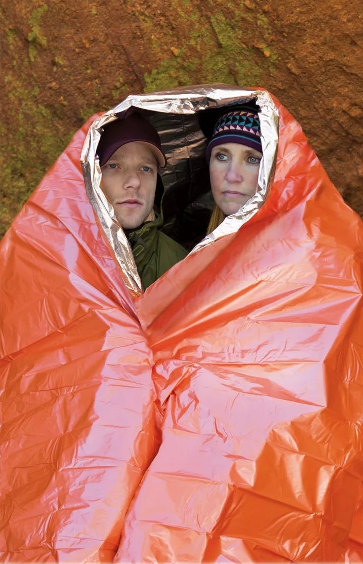 two models in the orange blanket