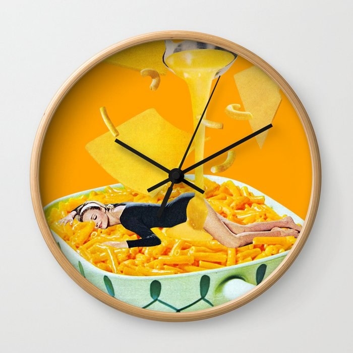 wall clock with collage of woman swimming in bowl of mac and cheese