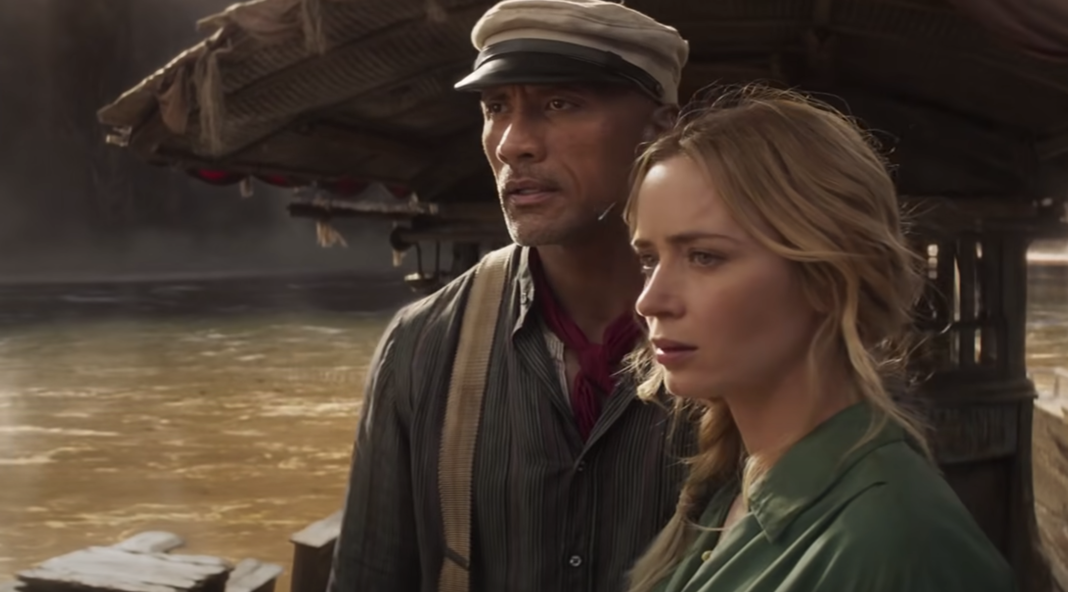 Lily and Frank looking ahead while standing next to each other on the boat