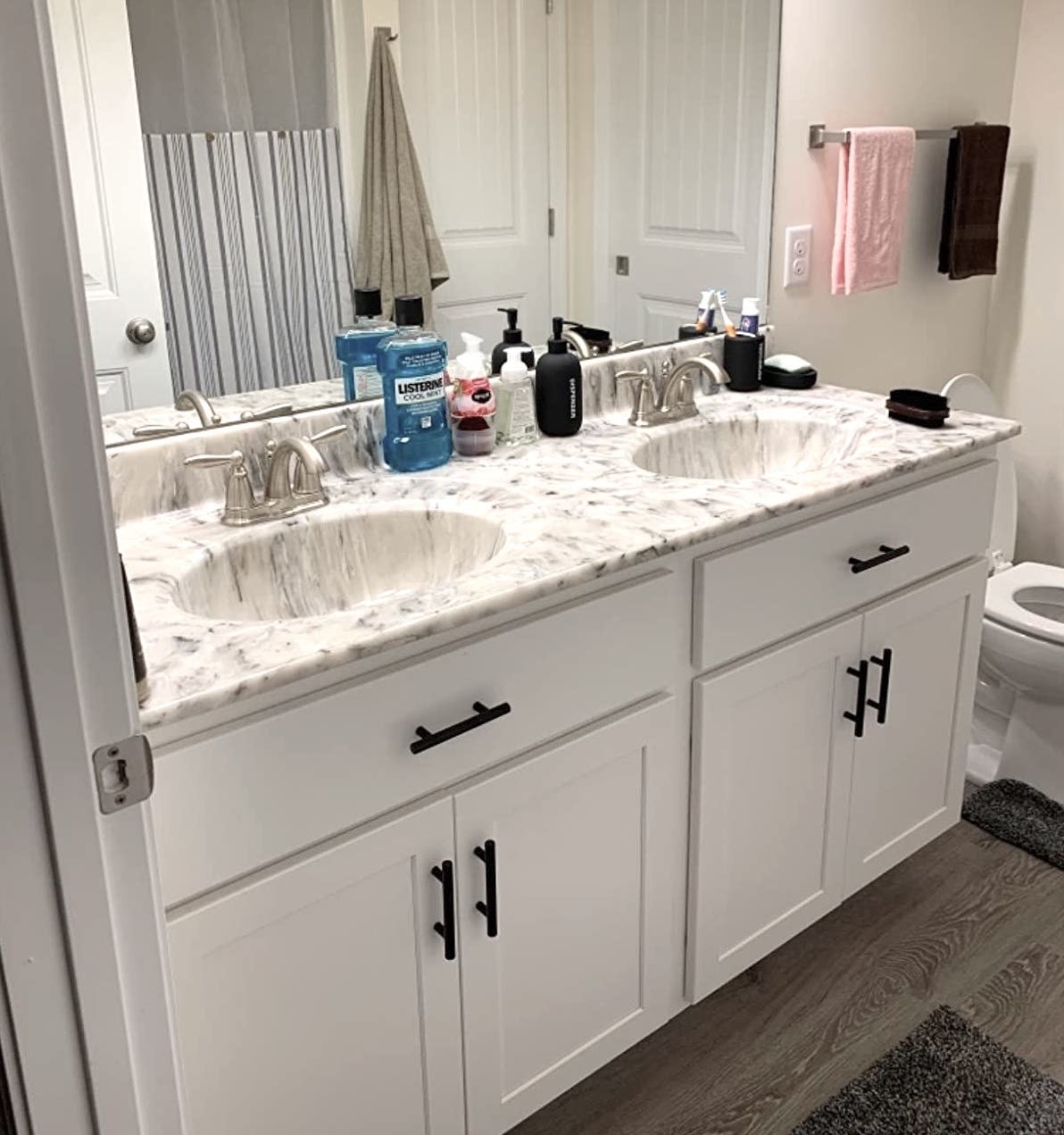 Reviewer&#x27;s bathroom shows the black cabinet pulls