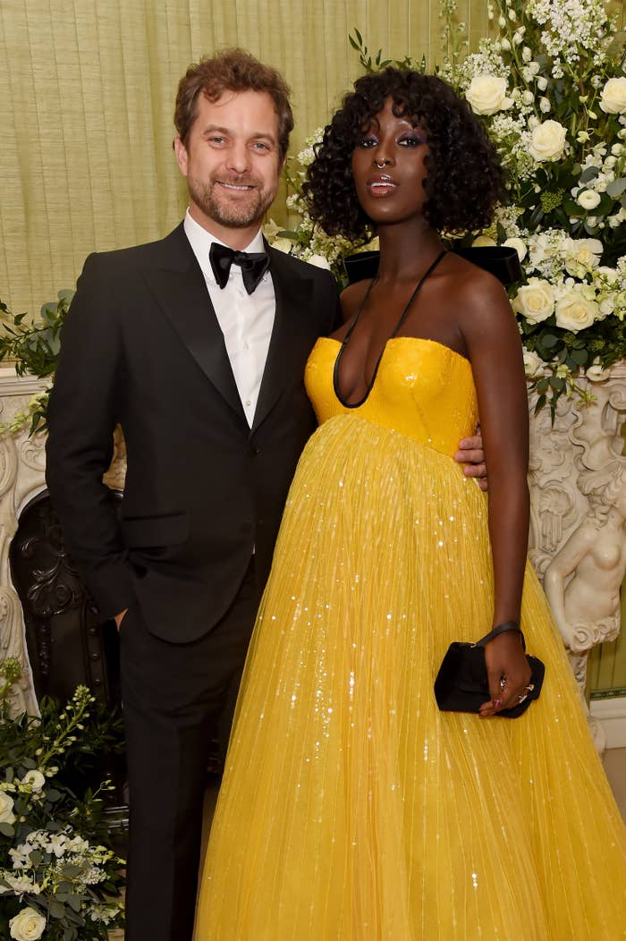 Joshua Jackson has his arm around Jodie Turner Smith as they pose for a photo on the red carpet