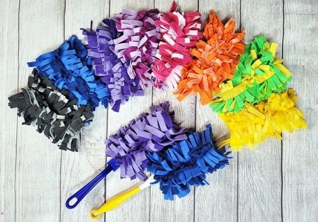 Cut up fleece fabric swiffer heads in different color combinations