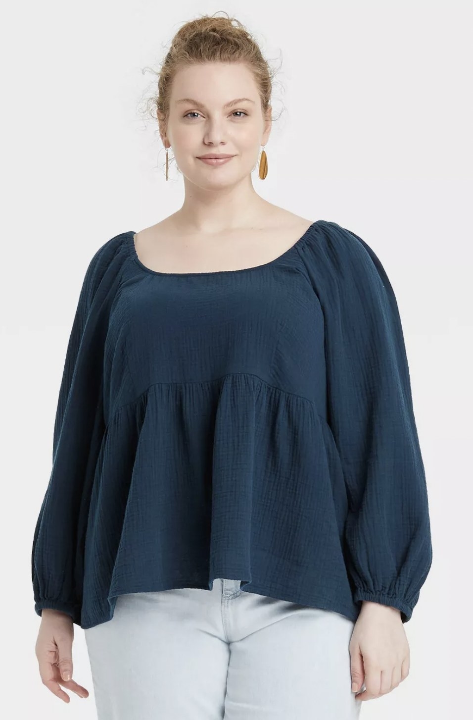 model wearing the blouse in blue