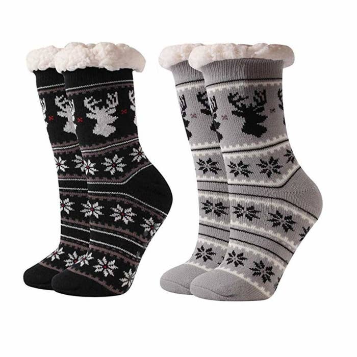 Two pairs of socks with a snowflake and reindeer print