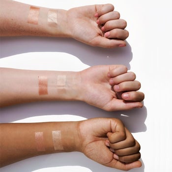 swatches of the two products on three different arms with different skin tones