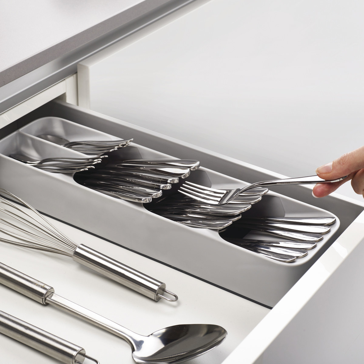 pulled out kitchen drawer with slim cutlery organizer in it and lots of room for other items in the drawer