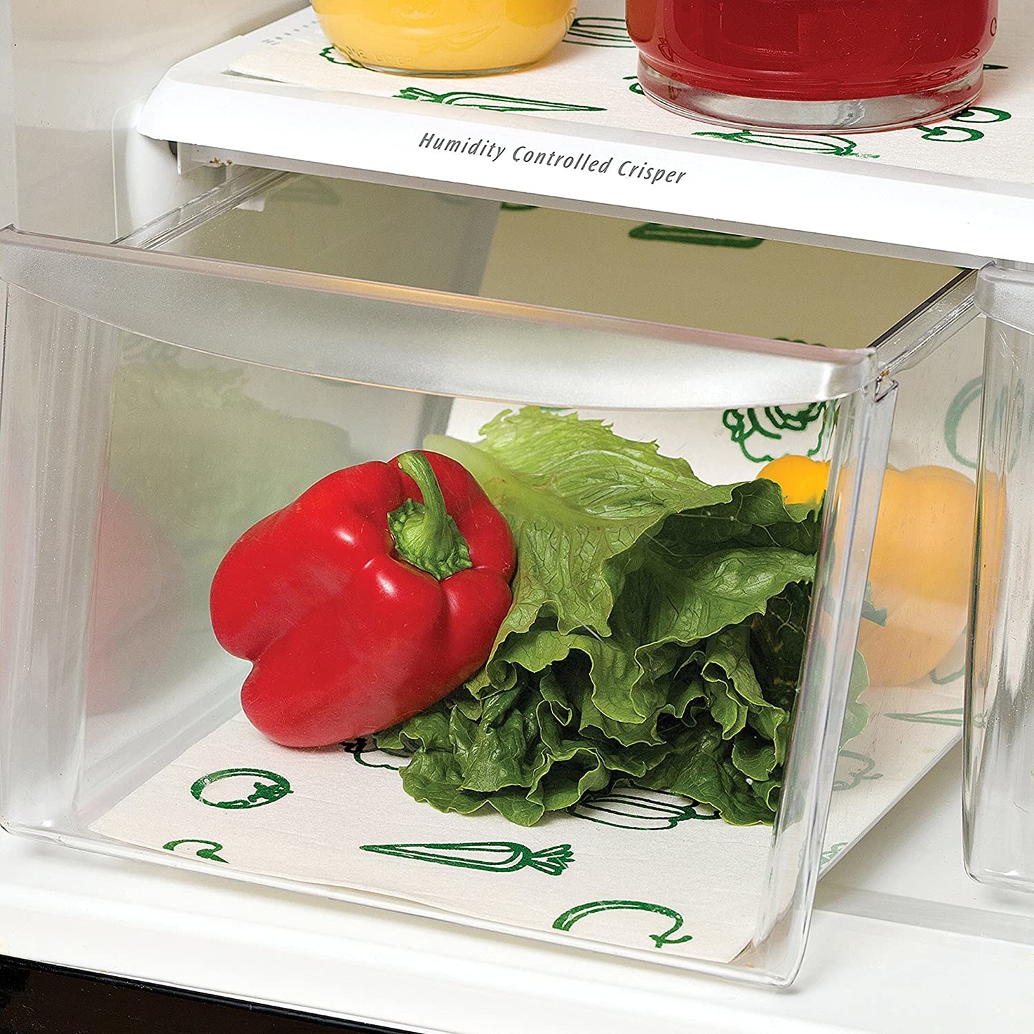 the liners in a produce drawer in an open fridge