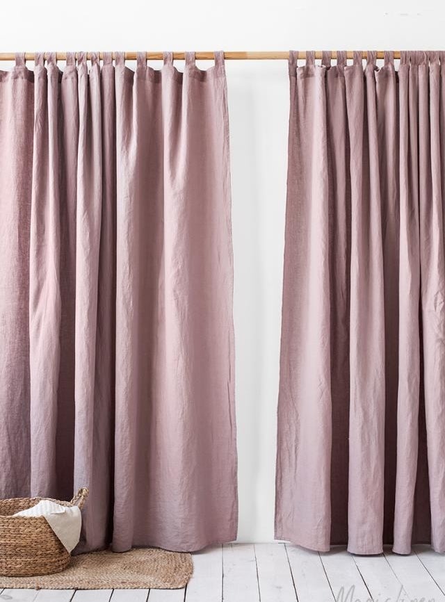 a set of dusty rose colored curtains