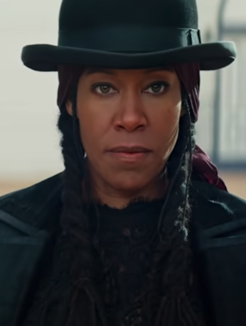 Regina King as a cowgirl with a serious demeanor on her face