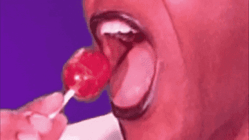 Guy sucking on a lollipop
