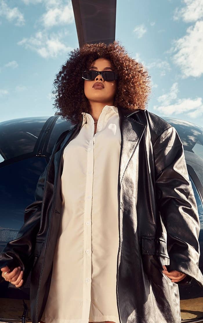 Model wearing black oversized blazer with white top