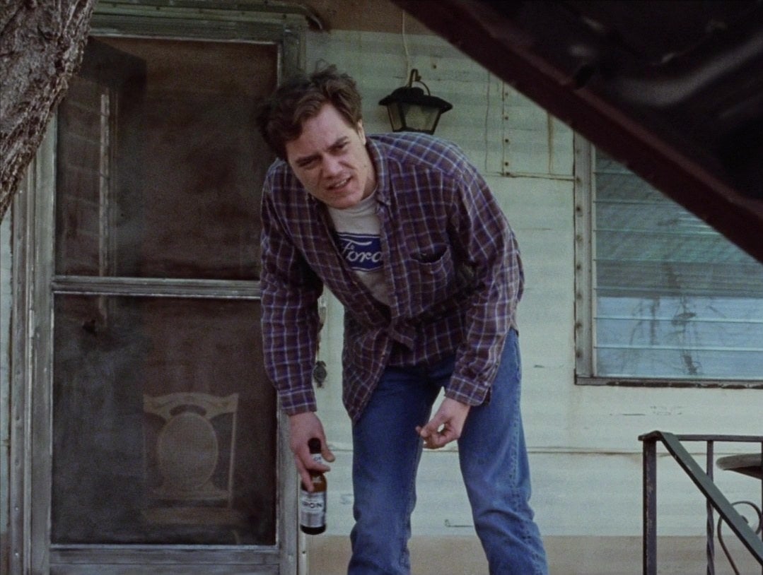 Michael Shannon bending over to talking to Eminem