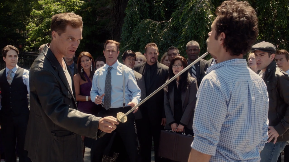 Michael Shannon pointing a sword at Paul Rudd