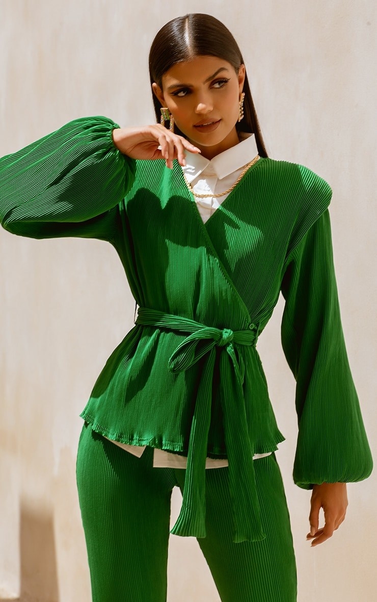 Model wearing green top with tee and matching green pants