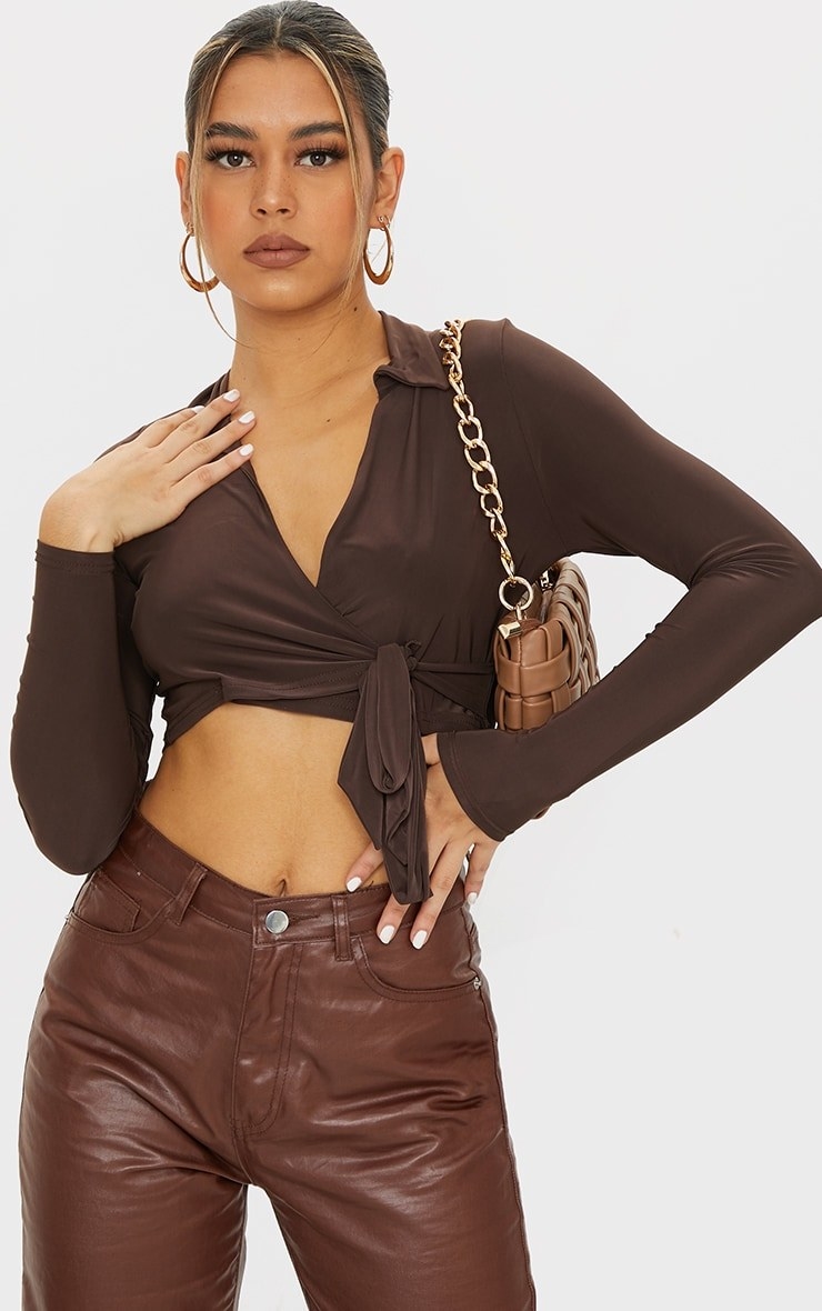 Model wearing brown cropped top with brown pants