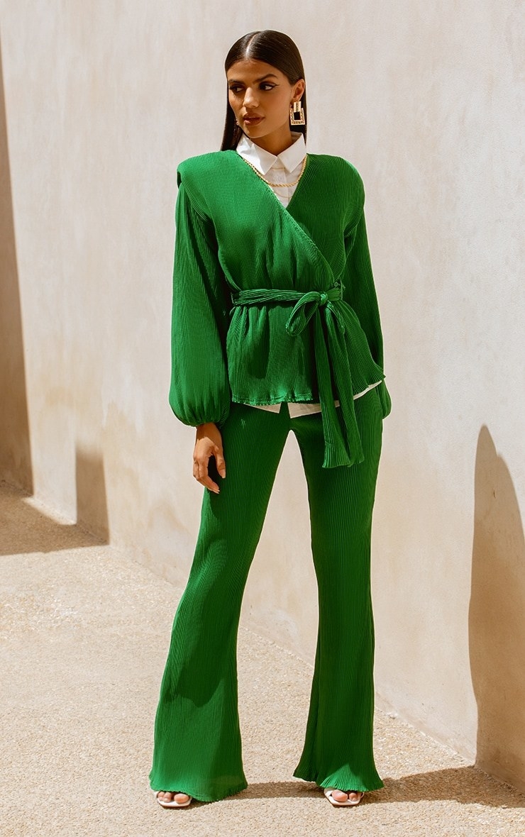 Model wearing green top with tee and matching green pants