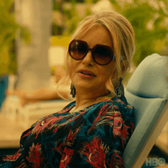 Tanya on a lounge in big sunglasses saying You&#x27;re a very pretty man