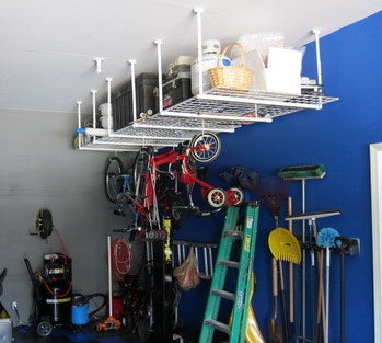reviewer&#x27;s ceiling mount shelves holding boxes and other things