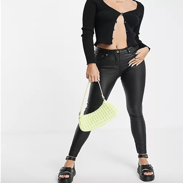 model wearing faux leather pants