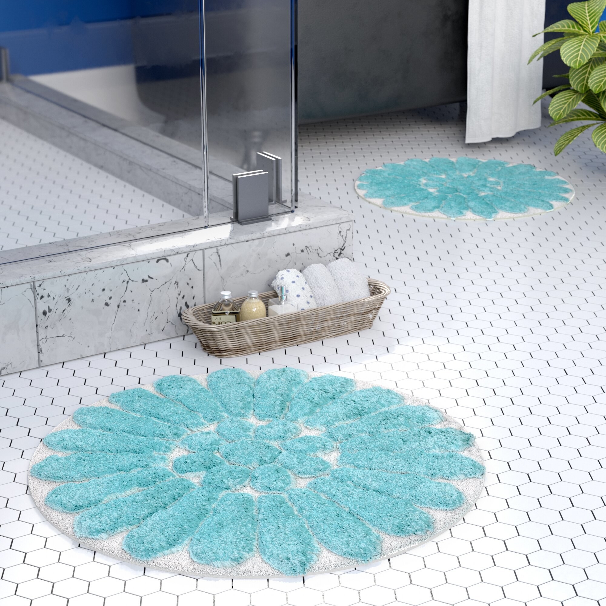 Two aqua flower rugs in a white tiled bathroom